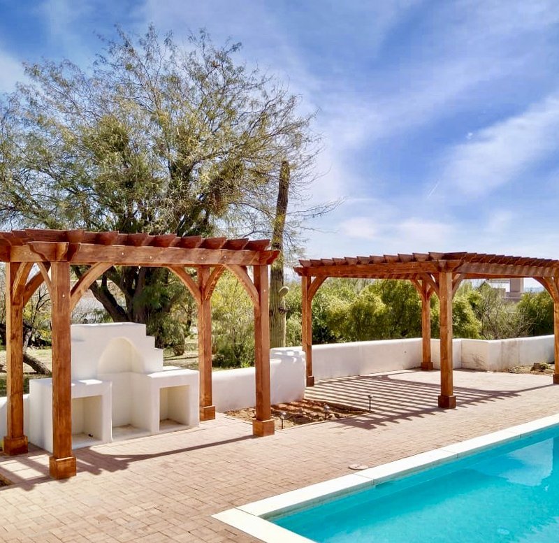 The Montvale Pergolas (Options: 14' x 8' & 20' x 16', Douglas-fir, Electrical Wiring Trim for 1 Post, Rafters at 16", Post Anchoring for Gale-Wind, No Ceiling Fan Base, No Privacy Panels, 10' Post, Transparent Premium Sealant). Photo courtesy of M. Simpson of Tucson, Arizona. The Montvale Pergolas (Options: 14' x 8' & 20' x 16', Douglas-fir, Electrical Wiring Trim for 1 Post, Rafters at 16", Post Anchoring for Gale-Wind, No Ceiling Fan Base, No Privacy Panels, 10' Post, Transparent Premium Sealant). Photo courtesy of M. Simpson of Tucson, Arizona.