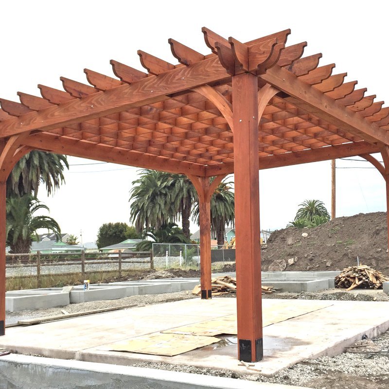The Montvale Pergola (Options: 16' x 20', Mature Redwood, Post Anchoring for Concrete, No Ceiling Fan Base, No Curtain Rods, No Privacy Panels, 9.5' Post, Transparent Premium Sealant). Photos taken in Carpinteria Garden Park during construction, May 10, 2017. Photo Courtesy of Carpinteria Park, 5775 Carpinteria Avenue Carpinteria, CA 93013. The Montvale Pergola (Options: 16' x 20', Mature Redwood, Post Anchoring for Concrete, No Ceiling Fan Base, No Curtain Rods, No Privacy Panels, 9.5' Post, Transparent Premium Sealant). Photos taken in Carpinteria Garden Park during construction, May 10, 2017. Photo Courtesy of Carpinteria Park, 5775 Carpinteria Avenue Carpinteria, CA 93013.