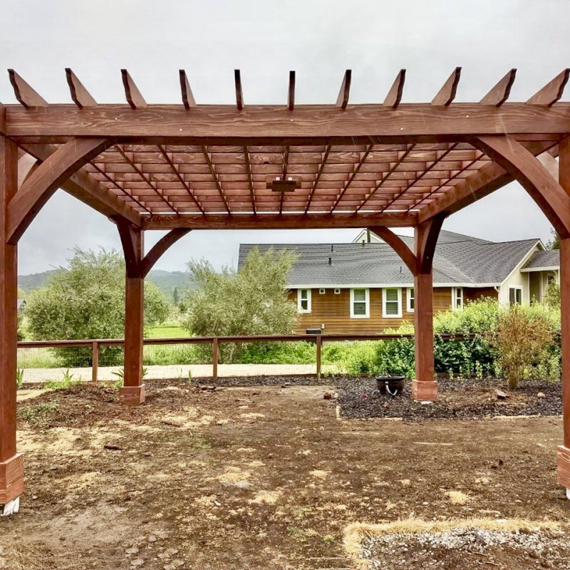 The Montvale Pergola (Options: 18' x 18', California Redwood, Post Anchoring for Gale-Wind, 1 Ceiling Fan Base, No Curtain Rods, No Privacy Panels, 10' Post, Coffee-Stain Premium Sealant). Photo Courtesy of M. Butler of Napa, CA. The Montvale Pergola (Options: 18' x 18', California Redwood, Post Anchoring for Gale-Wind, 1 Ceiling Fan Base, No Curtain Rods, No Privacy Panels, 10' Post, Coffee-Stain Premium Sealant). Photo Courtesy of M. Butler of Napa, CA.