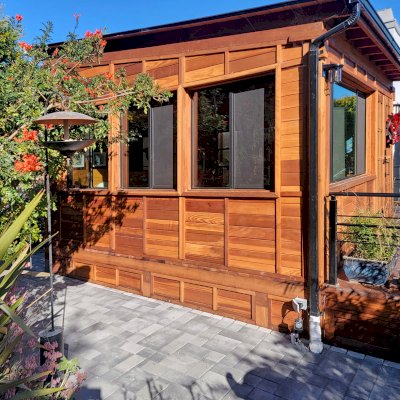 Palo Alto Backyard Cabin (Options: 18' L, 16' W, Without Porch, Structural Deck - Interior & 4' Exterior, California Redwood, Sugar Pine Internal Walls and Ceiling, Windows Purchased Locally, With Two 3' x 5' Skylights, Metal Roof, Custom Railings and Steps, Electrical Wire Trim on the Walls, Transparent Premium Sealant). Photo Courtesy of A. Ramon of South San Francisco, California.