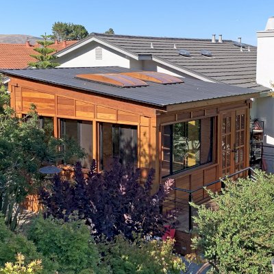 Palo Alto Backyard Cabin (Options: 18' L, 16' W, Without Porch, Structural Deck - Interior & 4' Exterior, California Redwood, Sugar Pine Internal Walls and Ceiling, Windows Purchased Locally, With Two 3' x 5' Skylights, Metal Roof, Custom Railings and Steps, Electrical Wire Trim on the Walls, Transparent Premium Sealant). Photo Courtesy of A. Ramon of South San Francisco, California.