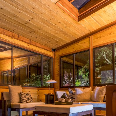 Palo Alto Backyard Cabin (Options: 18' L, 16' W, Without Porch, Structural Deck - Interior & 4' Exterior, California Redwood, Sugar Pine Internal Walls and Ceiling, Windows Purchased Locally, With Two 3' x 5' Skylights, Metal Roof, Custom Railings and Steps, Electrical Wire Trim on the Walls, Transparent Premium Sealant). Photo Courtesy of A. Ramon of South San Francisco, California.