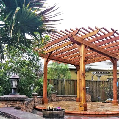 The Round Pergola (Options: 16' Diameter, No Privacy Panel, California Redwood, Open Roof Slats at 6", 9.5ft Post Height, Include Electrical Wiring Trim for 2 Posts, 4-Post Anchor Kit for Stone, No Post Decorative Trim, No Ceiling Fan Base, No Curtain Rods, Transparent Premium Sealant). Photo courtesy of Harish B. of Dublin, CA