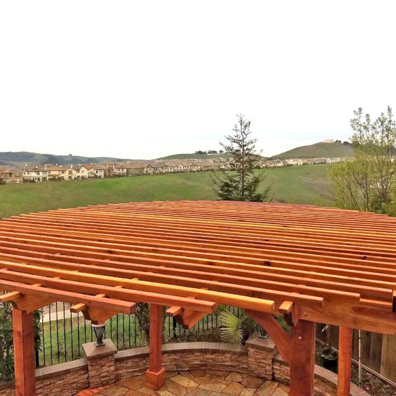 The Round Pergola (Options: 16' Diameter, No Privacy Panel, California Redwood, Open Roof Slats at 6", 9.5ft Post height, Include Electrical Wiring Trim for 2 Posts, 4-Post Anchor Kit for Stone or Concrete, No Post Decorative Trim, No Ceiling Fan Base, No Curtain Rods, Transparent Premium Sealant). Photo courtesy of Harish B. of Dublin, CA The Round Pergola (Options: 16' Diameter, No Privacy Panel, California Redwood, Open Roof Slats at 6", 9.5ft Post height, Include Electrical Wiring Trim for 2 Posts, 4-Post Anchor Kit for Stone or Concrete, No Post Decorative Trim, No Ceiling Fan Base, No Curtain Rods, Transparent Premium Sealant). Photo courtesy of Harish B. of Dublin, CA