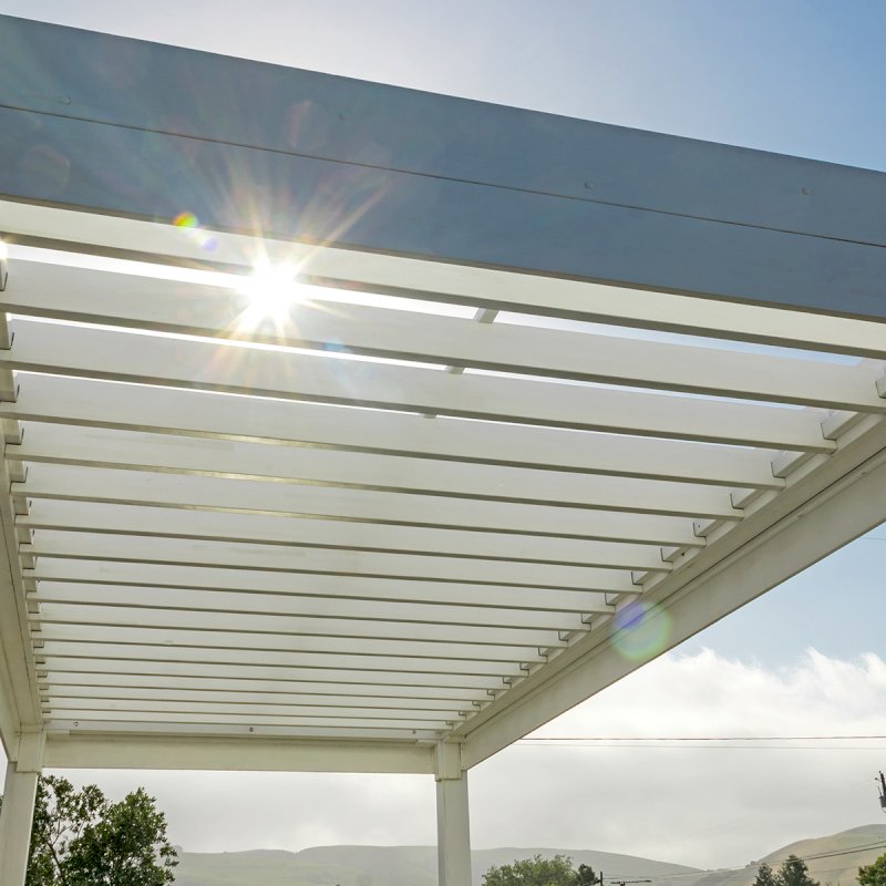 The Silverado Modern Pergola (Options: 20' L, 10' W, 12" Roof Rafter Spacing, Mosaic Eco-Wood, 4-Post Anchor kit for Concrete, White Primer). The Silverado Modern Pergola (Options: 20' L, 10' W, 12" Roof Rafter Spacing, Mosaic Eco-Wood, 4-Post Anchor kit for Concrete, White Primer).