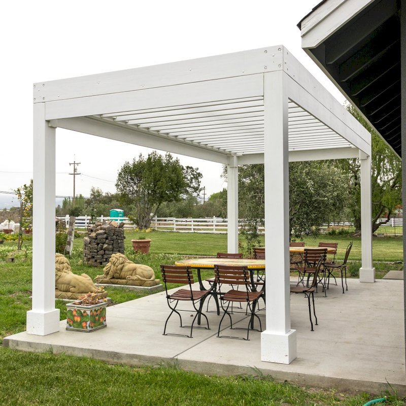 The Silverado Modern Pergola (Options: 20' L, 10' W, 12" Roof Rafter Spacing, Mosaic Eco-Wood, 4-Post Anchor kit for Concrete, White Primer). The Silverado Modern Pergola (Options: 20' L, 10' W, 12" Roof Rafter Spacing, Mosaic Eco-Wood, 4-Post Anchor kit for Concrete, White Primer).