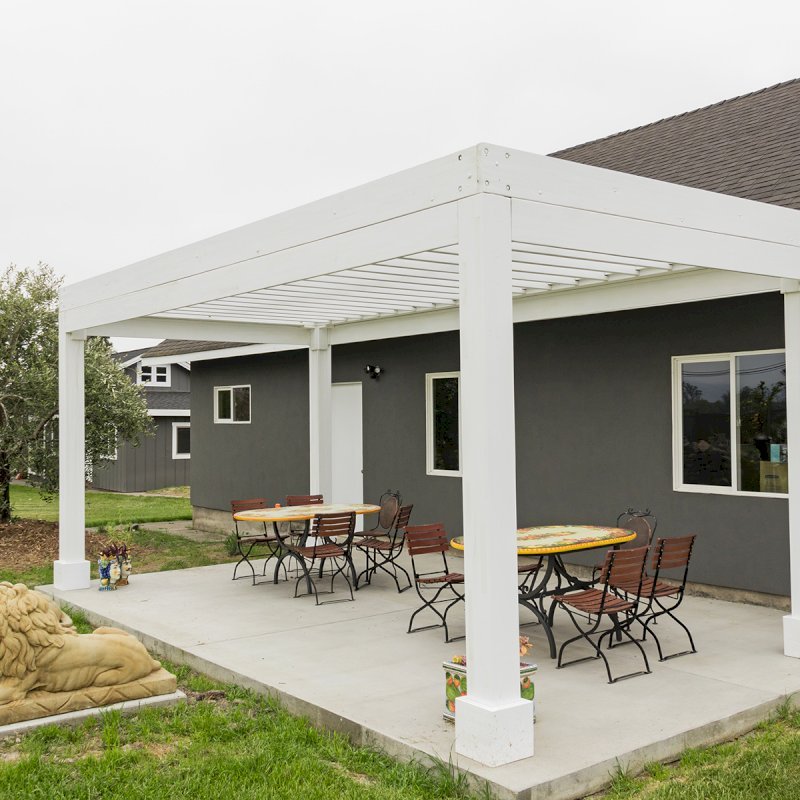 The Silverado Modern Pergola (Options: 20' L, 10' W, 12" Roof Rafter Spacing, Mosaic Eco-Wood, 4-Post Anchor kit for Concrete, White Primer). The Silverado Modern Pergola (Options: 20' L, 10' W, 12" Roof Rafter Spacing, Mosaic Eco-Wood, 4-Post Anchor kit for Concrete, White Primer).