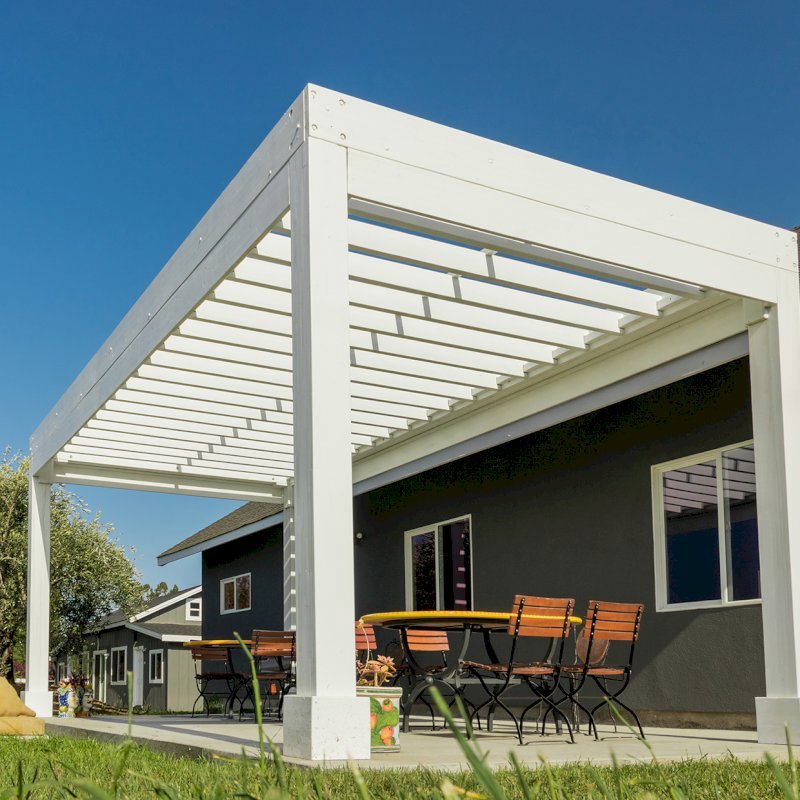 The Silverado Modern Pergola (Options: 20' L, 10' W, 12" Roof Rafter Spacing, Mosaic Eco-Wood, 4-Post Anchor kit for Concrete, White Primer). The Silverado Modern Pergola (Options: 20' L, 10' W, 12" Roof Rafter Spacing, Mosaic Eco-Wood, 4-Post Anchor kit for Concrete, White Primer).