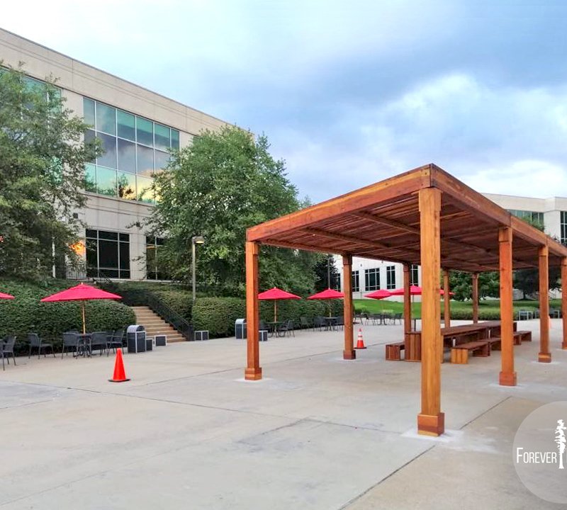 The Silverado Modern Pergola (options: 58' L, 16' W, Redwood, No Electrical Wiring Trim, with 1 3/4" x 11 1/4" Roof Support Timbers and 7 1/4" x 7 1/4" Posts, 8 Post Anchor Kit for Concrete, No Privacy Panels, No Curtain Rods, 10' Post Height, Transparent Premium Sealant). Photo Also Shows 2 Maynard Modern Redwood Patio Table Sets Under the Pergola. Photo Courtesy of A. Arena of Morristown, New Jersey. The Silverado Modern Pergola (options: 58' L, 16' W, Redwood, No Electrical Wiring Trim, with 1 3/4" x 11 1/4" Roof Support Timbers and 7 1/4" x 7 1/4" Posts, 8 Post Anchor Kit for Concrete, No Privacy Panels, No Curtain Rods, 10' Post Height, Transparent Premium Sealant). Photo Also Shows 2 Maynard Modern Redwood Patio Table Sets Under the Pergola. Photo Courtesy of A. Arena of Morristown, New Jersey.