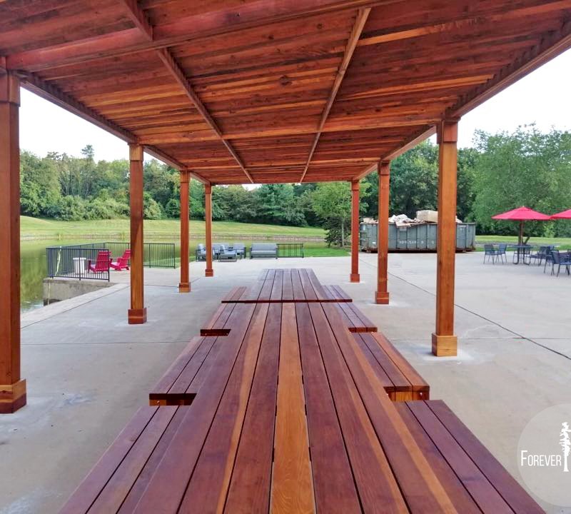 The Silverado Modern Pergola (options: 58' L, 16' W, Redwood, No Electrical Wiring Trim, with 1 3/4" x 11 1/4" Roof Support Timbers and 7 1/4" x 7 1/4" Posts, 8 Post Anchor Kit for Concrete, No Privacy Panels, No Curtain Rods, 10' Post Height, Transparent Premium Sealant). Photo Also Shows 2 Maynard Modern Redwood Patio Table Sets Under the Pergola. Photo Courtesy of A. Arena of Morristown, New Jersey. The Silverado Modern Pergola (options: 58' L, 16' W, Redwood, No Electrical Wiring Trim, with 1 3/4" x 11 1/4" Roof Support Timbers and 7 1/4" x 7 1/4" Posts, 8 Post Anchor Kit for Concrete, No Privacy Panels, No Curtain Rods, 10' Post Height, Transparent Premium Sealant). Photo Also Shows 2 Maynard Modern Redwood Patio Table Sets Under the Pergola. Photo Courtesy of A. Arena of Morristown, New Jersey.