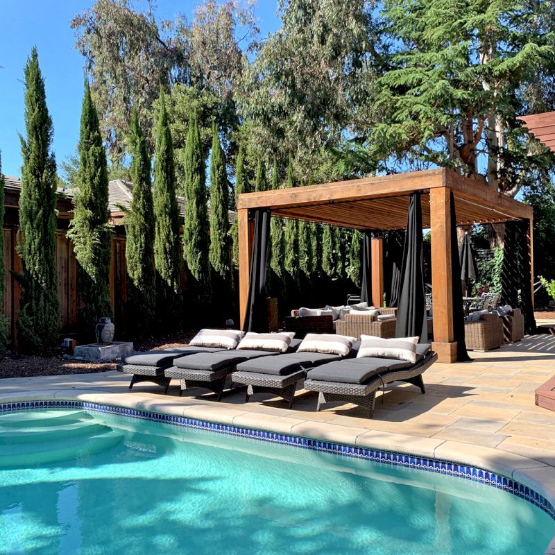 The Silverado Modern Pergola (Options: 7 1/4" x 7 1/4" Post Thickness, Standard Roof Stye, 20'L x 14'W, No Privacy Panels, California Redwood, No Rain Guard, 9ft Post Height, No Electrical Wiring Trim, 4 Post Anchor Kit for Concrete, 4 Curtain Rods, No Ceiling Fan Base, Transparent Premium Sealant). Photo Courtesy of B. Walsh of Atherton, California. The Silverado Modern Pergola (Options: 7 1/4" x 7 1/4" Post Thickness, Standard Roof Stye, 20'L x 14'W, No Privacy Panels, California Redwood, No Rain Guard, 9ft Post Height, No Electrical Wiring Trim, 4 Post Anchor Kit for Concrete, 4 Curtain Rods, No Ceiling Fan Base, Transparent Premium Sealant). Photo Courtesy of B. Walsh of Atherton, California.