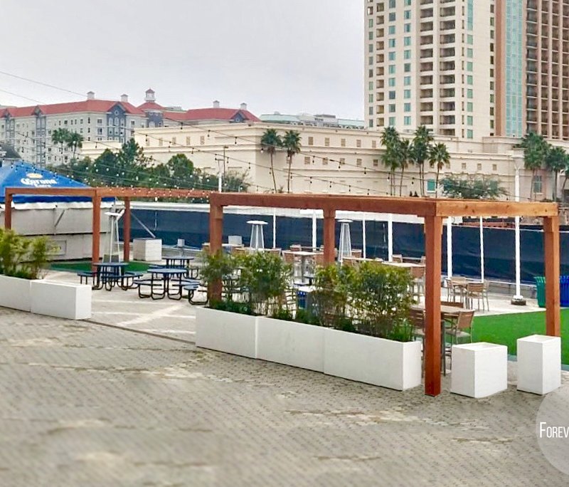 The Silverado Modern Pergolas (options: 20' L, 20' W, Douglas-fir, No Electrical Wiring Trim, 7 1/4" x 7 1/4" Posts, No Privacy Panels, No Curtain Rods, 9.5' Post Height, Transparent Premium Sealant). Photo Courtesy of The Tampa Bay Lightning NHL Team. The Silverado Modern Pergolas (options: 20' L, 20' W, Douglas-fir, No Electrical Wiring Trim, 7 1/4" x 7 1/4" Posts, No Privacy Panels, No Curtain Rods, 9.5' Post Height, Transparent Premium Sealant). Photo Courtesy of The Tampa Bay Lightning NHL Team.