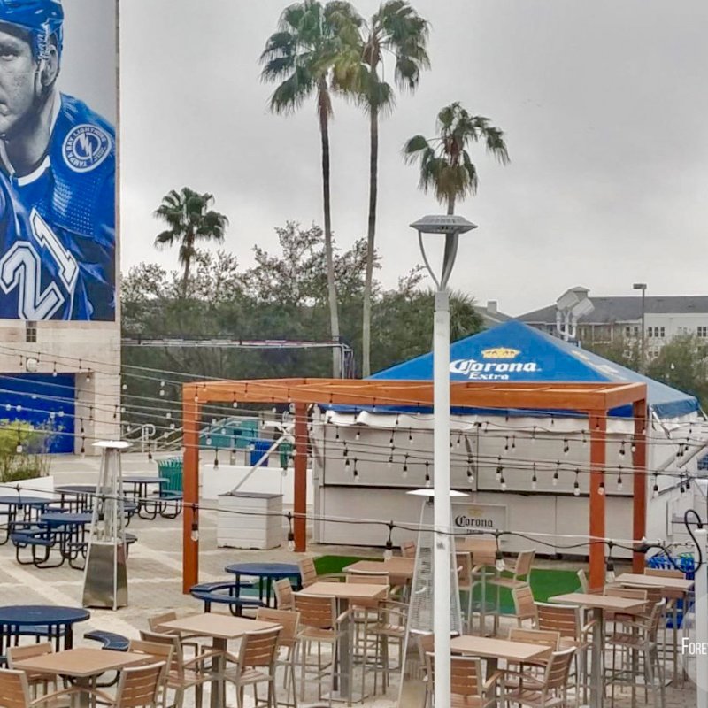 The Silverado Modern Pergola (options: 20' L, 20' W, Douglas-fir, No Electrical Wiring Trim, 7 1/4" x 7 1/4" Posts, No Privacy Panels, No Curtain Rods, 9.5' Post Height, Transparent Premium Sealant). Photo Courtesy of The Tampa Bay Lightning NHL Team. The Silverado Modern Pergola (options: 20' L, 20' W, Douglas-fir, No Electrical Wiring Trim, 7 1/4" x 7 1/4" Posts, No Privacy Panels, No Curtain Rods, 9.5' Post Height, Transparent Premium Sealant). Photo Courtesy of The Tampa Bay Lightning NHL Team.