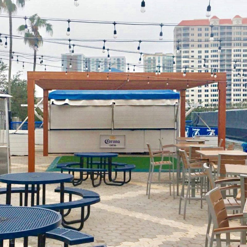 The Silverado Modern Pergola (options: 20' L, 20' W, Douglas-fir, No Electrical Wiring Trim, 7 1/4" x 7 1/4" Posts, No Privacy Panels, No Curtain Rods, 9.5' Post Height, Transparent Premium Sealant). Photo Courtesy of The Tampa Bay Lightning NHL Team. The Silverado Modern Pergola (options: 20' L, 20' W, Douglas-fir, No Electrical Wiring Trim, 7 1/4" x 7 1/4" Posts, No Privacy Panels, No Curtain Rods, 9.5' Post Height, Transparent Premium Sealant). Photo Courtesy of The Tampa Bay Lightning NHL Team.
