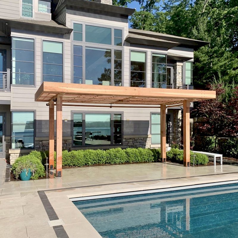 The Silverado Modern Pergola (options: 23' L, 9'-6" W, California Redwood, 1 Electrical Wiring Trim, 7 1/4" x 7 1/4" Posts, No Privacy Panels, 3 Curtain Rods, 1 Ceiling Fan Base, 10' Post Height, Unfinished-Customer will Stain on Site). Photo Courtesy of J. Maskill of Rockford, Michigan. The Silverado Modern Pergola (options: 23' L, 9'-6" W, California Redwood, 1 Electrical Wiring Trim, 7 1/4" x 7 1/4" Posts, No Privacy Panels, 3 Curtain Rods, 1 Ceiling Fan Base, 10' Post Height, Unfinished-Customer will Stain on Site). Photo Courtesy of J. Maskill of Rockford, Michigan.