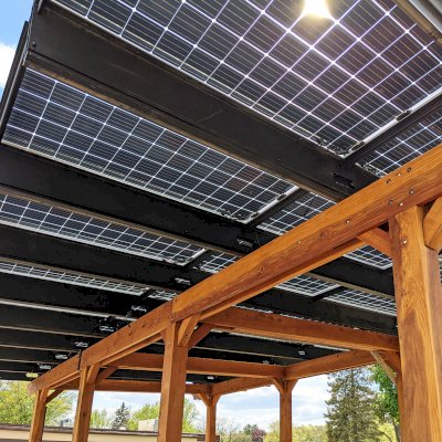 The Solar Pergola (Options: 33' x 14', California Redwood, 8-Post Anchor Kit for High-Wind, Transparent Premium Sealant). Solar Panels Installed by Customer. Photo Courtesy of C. Couillard of Deerfield, Wisconsin.