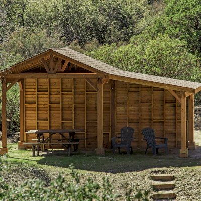 Sunset Patio Pavilion Attached to a 12' x 12' Del Norte Pavilion (Options: 9' x 12', Douglas-fir, No Ceiling Fan Base, No Electrical Wiring Trim Kit, 2-Post Anchor Kit for High-Wind, with Custom Solid Wall, Transparent Premium Sealant). Photo Courtesy of J. Randall of Warner Springs, CA.
