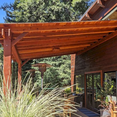 The Sunset Porch Pavilion (Options: 18' L x 15' W, California Redwood, Attached to House, 22ft H Posts [From Ground to Tall Deck] by Custom Request, No Electrical Wiring Trim, 2-Post Anchor Kit for Concrete, No Post Decorative Trim, No Ceiling Fan Base, No Curtain Rods, Transparent Premium Sealant). Photo Courtesy of L. Draper of Aptos, California.