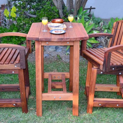 The Tete-a-Tete Outdoor Wood Cocktail & Bar Stool Set (Options: Vera's Armchair, Mature Redwood, with Swivels, No Cushions, Standard Tabletop, No Umbrella Hole, Transparent Premium Sealant). 