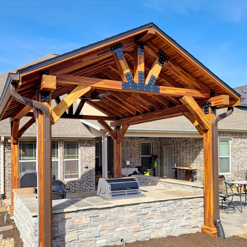 The Thick Timber Toledo Wood Pavilions (Options: 16' L x 14' W, Mosaic Eco-Wood, 4-Post Anchor Kit for High-Wind, Electrical Wiring Trim for 1 Post, 8 x 8 Supports and Posts, 8 x 8 Rafters, 1 Fan Base, Transparent Premium Sealant). Photo Courtesy of A. Shaver of Rogers, Arkansas. The Thick Timber Toledo Wood Pavilions (Options: 16' L x 14' W, Mosaic Eco-Wood, 4-Post Anchor Kit for High-Wind, Electrical Wiring Trim for 1 Post, 8 x 8 Supports and Posts, 8 x 8 Rafters, 1 Fan Base, Transparent Premium Sealant). Photo Courtesy of A. Shaver of Rogers, Arkansas.