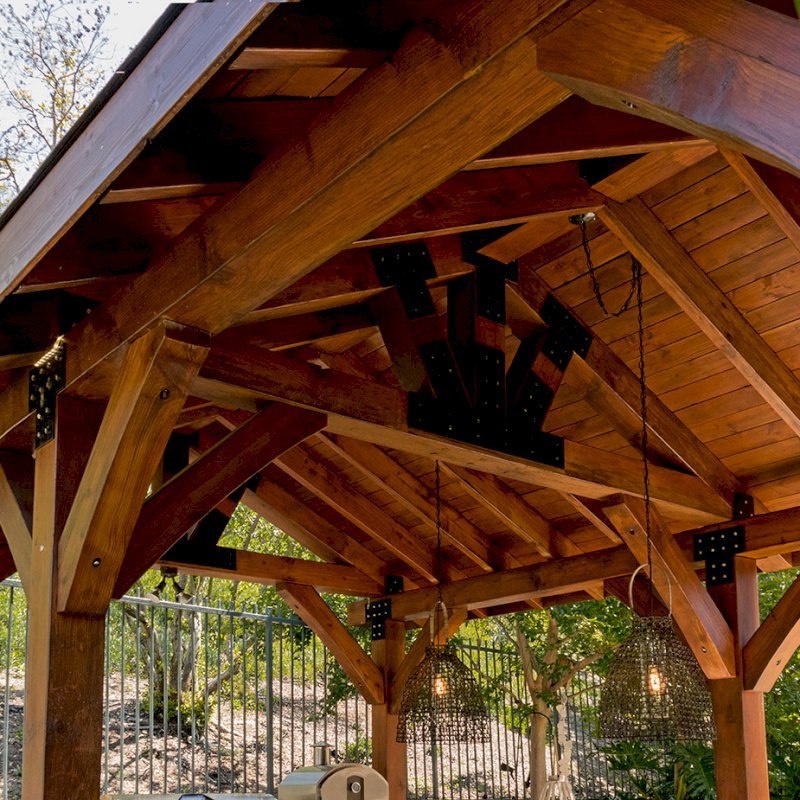 The Thick Timber Toledo Wood Pavilions (Options: 22' L x 14' W, Douglas-fir, 6-Post Anchor Kit for Gale-Wind, Electrical Wiring Trim for 1 Post, 8 x 8 Supports and Posts, 8 x 8 Rafters, No Fan Bases, Coffee-Stain Premium Sealant). Photo Courtesy of M. Moffitt Jackson of Foothills Ranch, California. The Thick Timber Toledo Wood Pavilions (Options: 22' L x 14' W, Douglas-fir, 6-Post Anchor Kit for Gale-Wind, Electrical Wiring Trim for 1 Post, 8 x 8 Supports and Posts, 8 x 8 Rafters, No Fan Bases, Coffee-Stain Premium Sealant). Photo Courtesy of M. Moffitt Jackson of Foothills Ranch, California.