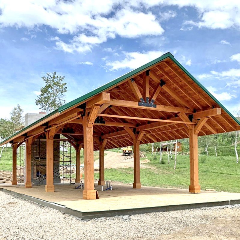 The Thick Timber Toledo Wood Pavilions (Options: 50' L x 24' W, Douglas-fir, 8-Post Anchor Kit for Gale-Wind, with Curtain Rods, Electrical Wiring Trim for 4 Posts, 10 x 10 Supports and Posts, 8 x 8 Rafters, Transparent Premium Sealant). Custom 4' Overhang on All Sides (Standard Overhang is 1'). Photo Courtesy of R. Barry of Hayden, Colorado. The Thick Timber Toledo Wood Pavilions (Options: 50' L x 24' W, Douglas-fir, 8-Post Anchor Kit for Gale-Wind, with Curtain Rods, Electrical Wiring Trim for 4 Posts, 10 x 10 Supports and Posts, 8 x 8 Rafters, Transparent Premium Sealant). Custom 4' Overhang on All Sides (Standard Overhang is 1'). Photo Courtesy of R. Barry of Hayden, Colorado.