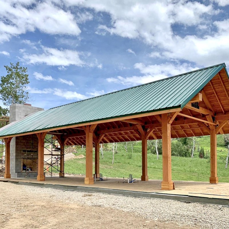 The Thick Timber Toledo Wood Pavilions (Options: 50' L x 24' W, Douglas-fir, 8-Post Anchor Kit for Gale-Wind, with Curtain Rods, Electrical Wiring Trim for 4 Posts, 10 x 10 Supports and Posts, 8 x 8 Rafters, Transparent Premium Sealant). Custom 4' Overhang on All Sides (Standard Overhang is 1'). Photo Courtesy of R. Barry of Hayden, Colorado. The Thick Timber Toledo Wood Pavilions (Options: 50' L x 24' W, Douglas-fir, 8-Post Anchor Kit for Gale-Wind, with Curtain Rods, Electrical Wiring Trim for 4 Posts, 10 x 10 Supports and Posts, 8 x 8 Rafters, Transparent Premium Sealant). Custom 4' Overhang on All Sides (Standard Overhang is 1'). Photo Courtesy of R. Barry of Hayden, Colorado.