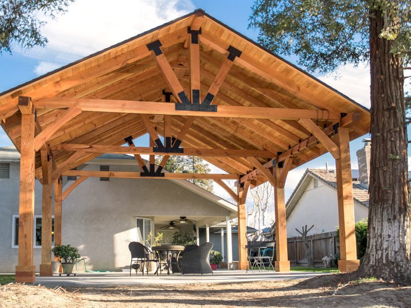 The Thick Timber Toledo Wood Pavilions (Options: 27' L x 25' W, Douglas-fir, 6-Post Anchor Kit for Gale-Wind, Electrical Wiring Trim for 2 Posts, 8 x 8 Supports and Posts, 8 x 8 Rafters, 2 Fan Bases, Transparent Premium Sealant). Photo Courtesy of T. Lane of Kingsburg, CA. The Thick Timber Toledo Wood Pavilions (Options: 27' L x 25' W, Douglas-fir, 6-Post Anchor Kit for Gale-Wind, Electrical Wiring Trim for 2 Posts, 8 x 8 Supports and Posts, 8 x 8 Rafters, 2 Fan Bases, Transparent Premium Sealant). Photo Courtesy of T. Lane of Kingsburg, CA.