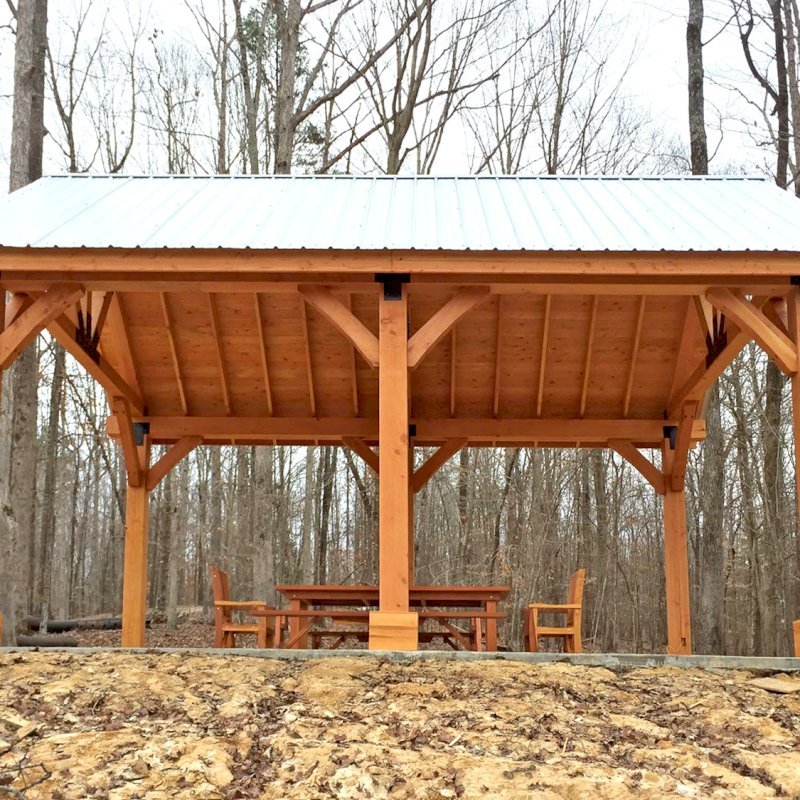 The Thick Timber Toledo Wood Pavilions (Options: 26' L x 20' W, Douglas-fir, 6-Post Anchor Kit for Gale-Wind, Electrical Wiring Trim for 3 Posts, 10 x 10 Supports and Posts, 8 x 8 Rafters, Transparent Premium Sealant). Photo Also Shows a Patio Table Set with Side Benches and End Chairs. Photo Courtesy of M. Turner of Thaxton, MS. The Thick Timber Toledo Wood Pavilions (Options: 26' L x 20' W, Douglas-fir, 6-Post Anchor Kit for Gale-Wind, Electrical Wiring Trim for 3 Posts, 10 x 10 Supports and Posts, 8 x 8 Rafters, Transparent Premium Sealant). Photo Also Shows a Patio Table Set with Side Benches and End Chairs. Photo Courtesy of M. Turner of Thaxton, MS.