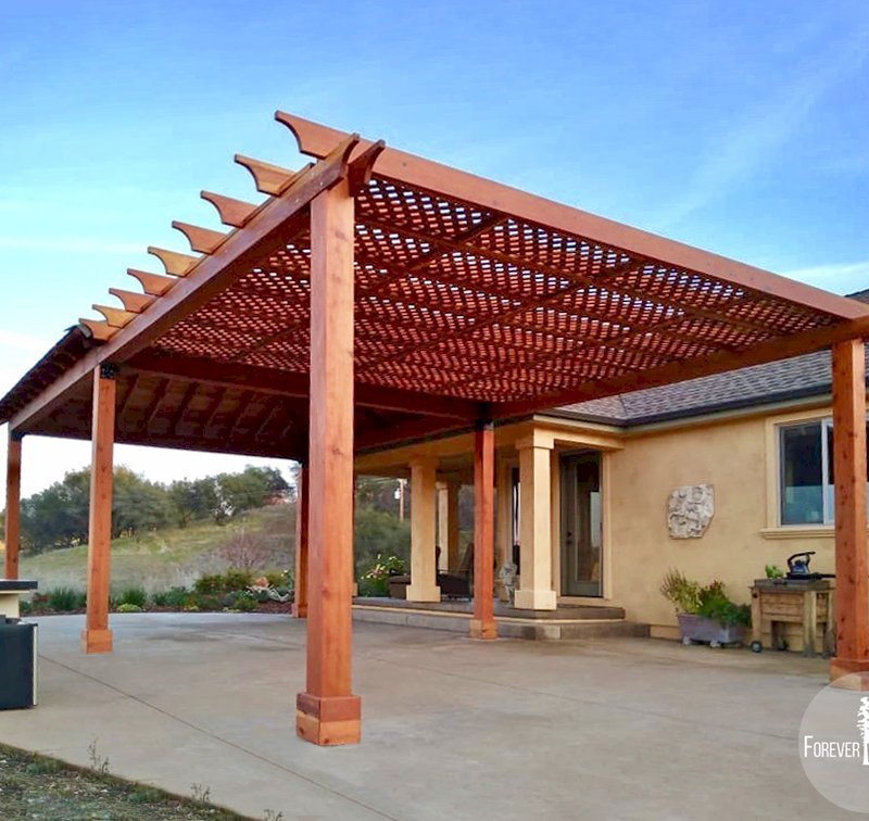 The Traditional Wooden Garden Pergola & Loreto Pavilion (Options: 16' L x 20' W, Attached to a 20' x 20' Loreto Pavilion, California Redwood, No Electrical Wiring Trim, Lattice Roof, Widthwise Roof Support Timbers, 6-Post Anchor Kit for Gale-Wind, No Ceiling Fan Base, No Privacy Panels, No Curtain Rods, 9.5' Post Height, Transparent Premium Sealant). Photo Courtesy of R. Offenbach of Ione, CA. The Traditional Wooden Garden Pergola & Loreto Pavilion (Options: 16' L x 20' W, Attached to a 20' x 20' Loreto Pavilion, California Redwood, No Electrical Wiring Trim, Lattice Roof, Widthwise Roof Support Timbers, 6-Post Anchor Kit for Gale-Wind, No Ceiling Fan Base, No Privacy Panels, No Curtain Rods, 9.5' Post Height, Transparent Premium Sealant). Photo Courtesy of R. Offenbach of Ione, CA.