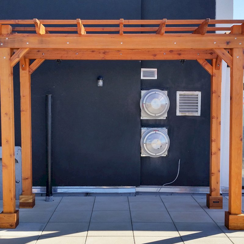 The Traditional Wooden Garden Pergola (Options: 12' L x 6' W, California Redwood, No Electrical Wiring Trim, Lengthwise Roof Support, Open Roof with Slats at 18", Rafters at 18", 4-Post Anchor Kit for Concrete, No Ceiling Fan Base, No Privacy Panels, No Curtain Rods, 9' Post Height, Transparent Premium Sealant). Photo Courtesy of Abe G. of Brooklyn, NY. The Traditional Wooden Garden Pergola (Options: 12' L x 6' W, California Redwood, No Electrical Wiring Trim, Lengthwise Roof Support, Open Roof with Slats at 18", Rafters at 18", 4-Post Anchor Kit for Concrete, No Ceiling Fan Base, No Privacy Panels, No Curtain Rods, 9' Post Height, Transparent Premium Sealant). Photo Courtesy of Abe G. of Brooklyn, NY.