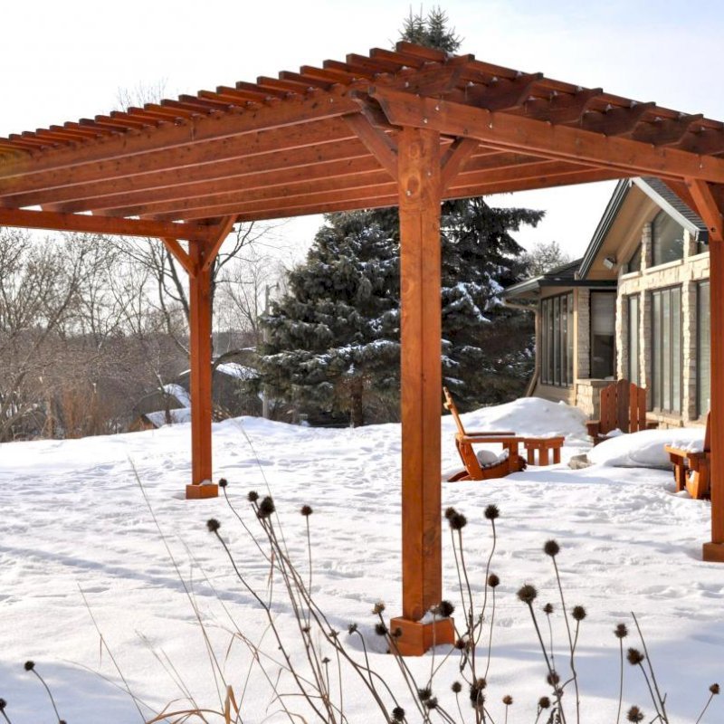 The Traditional Wooden Garden Pergola (Options: 20' L x 14' W, Mature Redwood, No Electrical Wiring Trim, Slats at 6" and Rafters at 18", Lengthwise Roof Support Timbers, 4-Post Anchor Kit for Stone, No Ceiling Fan Base, No Privacy Panels, No Curtain Rods, 9' Post Height, Transparent Premium Sealant). Photo Courtesy of Mary Louise and Gerry Neugent of Des Moines, IA. The Traditional Wooden Garden Pergola (Options: 20' L x 14' W, Mature Redwood, No Electrical Wiring Trim, Slats at 6" and Rafters at 18", Lengthwise Roof Support Timbers, 4-Post Anchor Kit for Stone, No Ceiling Fan Base, No Privacy Panels, No Curtain Rods, 9' Post Height, Transparent Premium Sealant). Photo Courtesy of Mary Louise and Gerry Neugent of Des Moines, IA.