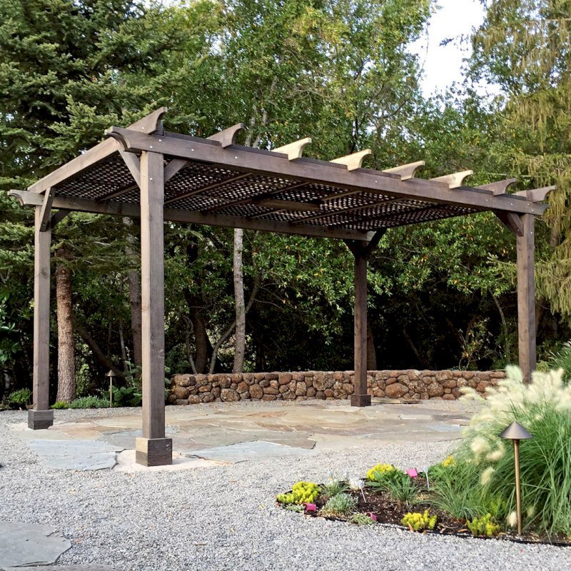 The Traditional Wooden Garden Pergola (Options: 16' L x 12' W, California Redwood, No Electrical Wiring Trim, Lattice Roof, Lengthwise Roof Support Timbers, 4-Post Anchor Kit for Stone, No Ceiling Fan Base, No Privacy Panels, No Curtain Rods, 9' Post Height, Custom Finish). Photo Courtesy of B. Savard of San Rafael, CA. The Traditional Wooden Garden Pergola (Options: 16' L x 12' W, California Redwood, No Electrical Wiring Trim, Lattice Roof, Lengthwise Roof Support Timbers, 4-Post Anchor Kit for Stone, No Ceiling Fan Base, No Privacy Panels, No Curtain Rods, 9' Post Height, Custom Finish). Photo Courtesy of B. Savard of San Rafael, CA.
