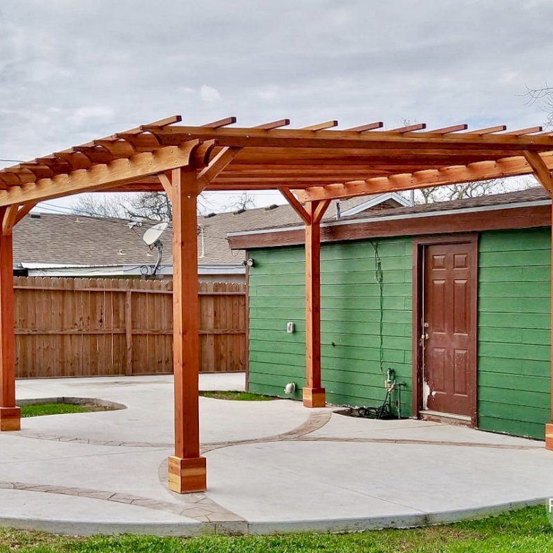 The Traditional Wooden Garden Pergola (Options: 16' L x 16' W, California Redwood, No Electrical Wiring Trim, Open Roof with Slats at 18", Rafters at 18", 4-Post Anchor Kit for Concrete, No Ceiling Fan Base, No Privacy Panels, No Curtain Rods, Two-9' Posts & Two-10' Posts, Transparent Premium Sealant). Customer Requested Slight Slant to the Roof. Photo Courtesy of G. Genoway of Portland, Texas. The Traditional Wooden Garden Pergola (Options: 16' L x 16' W, California Redwood, No Electrical Wiring Trim, Open Roof with Slats at 18", Rafters at 18", 4-Post Anchor Kit for Concrete, No Ceiling Fan Base, No Privacy Panels, No Curtain Rods, Two-9' Posts & Two-10' Posts, Transparent Premium Sealant). Customer Requested Slight Slant to the Roof. Photo Courtesy of G. Genoway of Portland, Texas.