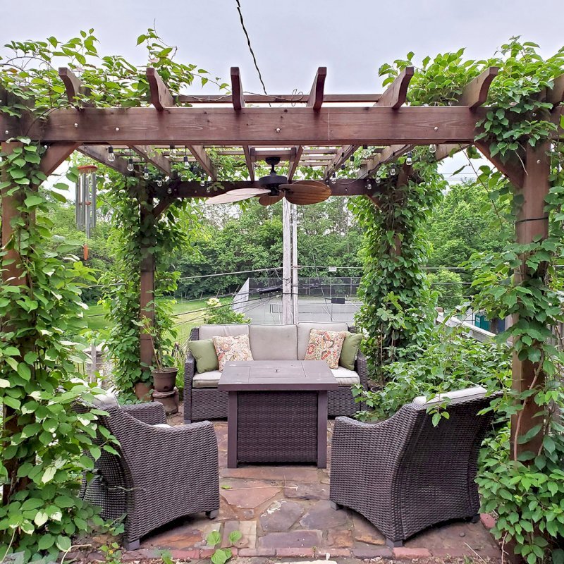 The Traditional Wooden Garden Pergola (Options: 14' L x 12' W, Mature Redwood, No Electrical Wiring Trim, Open Roof with Slats at 18", Rafters at 18", Lengthwise Roof Support Timbers, 4-Post Anchor Kit for Concrete, No Ceiling Fan Base, No Privacy Panels, No Curtain Rods, 9' Post Height, Transparent Premium Sealant). Photo Courtesy of D. Vickery of St. Paul, Minnesota. The Traditional Wooden Garden Pergola (Options: 14' L x 12' W, Mature Redwood, No Electrical Wiring Trim, Open Roof with Slats at 18", Rafters at 18", Lengthwise Roof Support Timbers, 4-Post Anchor Kit for Concrete, No Ceiling Fan Base, No Privacy Panels, No Curtain Rods, 9' Post Height, Transparent Premium Sealant). Photo Courtesy of D. Vickery of St. Paul, Minnesota.