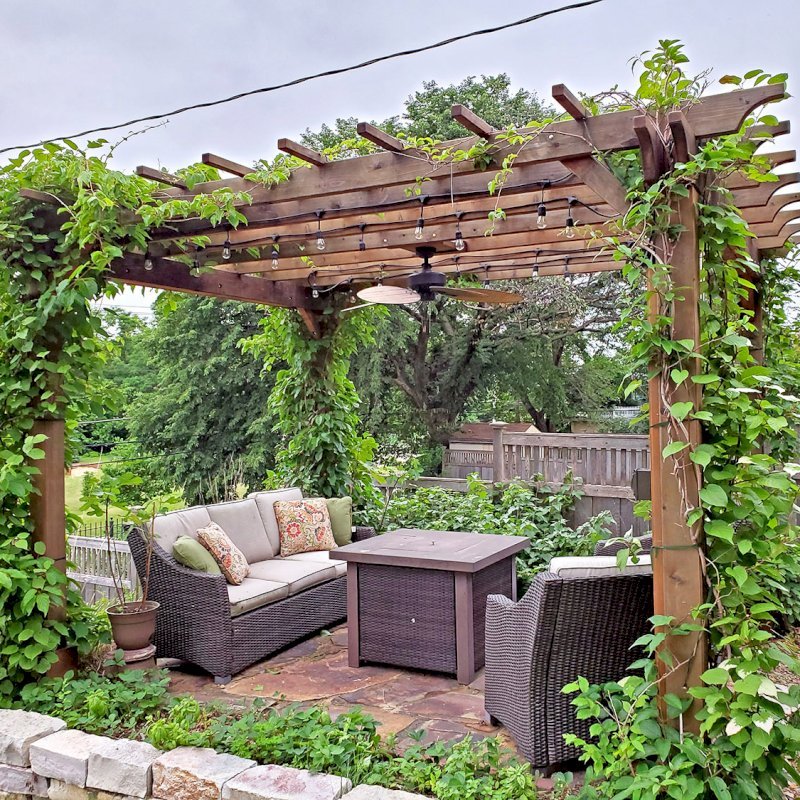 The Traditional Wooden Garden Pergola (Options: 14' L x 12' W, Mature Redwood, No Electrical Wiring Trim, Open Roof with Slats at 18", Rafters at 18", Lengthwise Roof Support Timbers, 4-Post Anchor Kit for Concrete, No Ceiling Fan Base, No Privacy Panels, No Curtain Rods, 9' Post Height, Transparent Premium Sealant). Photo Courtesy of D. Vickery of St. Paul, Minnesota. The Traditional Wooden Garden Pergola (Options: 14' L x 12' W, Mature Redwood, No Electrical Wiring Trim, Open Roof with Slats at 18", Rafters at 18", Lengthwise Roof Support Timbers, 4-Post Anchor Kit for Concrete, No Ceiling Fan Base, No Privacy Panels, No Curtain Rods, 9' Post Height, Transparent Premium Sealant). Photo Courtesy of D. Vickery of St. Paul, Minnesota.