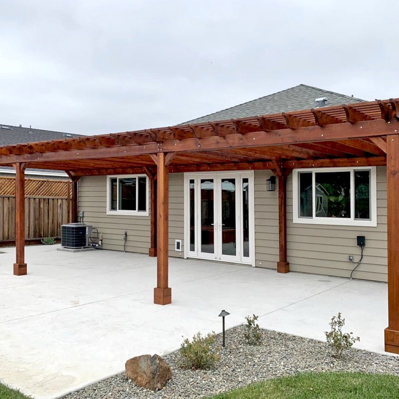The Traditional Wooden Garden Pergola (Options: 42’ L x 16’-3 1/2” W, Old-Growth Redwood by Custom Request, No Electrical Wiring Trim, Open Roof with Slats at 6", Rafters at 18", 8-Post Anchor Kit for Concrete, No Ceiling Fan Base, No Privacy Panels, No Post Decorative Trims, No Curtain Rod, 10' Post Height, Transparent Premium Sealant). Photo Courtesy of D. Menzel of Santa Rosa, CA. The Traditional Wooden Garden Pergola (Options: 42’ L x 16’-3 1/2” W, Old-Growth Redwood by Custom Request, No Electrical Wiring Trim, Open Roof with Slats at 6", Rafters at 18", 8-Post Anchor Kit for Concrete, No Ceiling Fan Base, No Privacy Panels, No Post Decorative Trims, No Curtain Rod, 10' Post Height, Transparent Premium Sealant). Photo Courtesy of D. Menzel of Santa Rosa, CA.