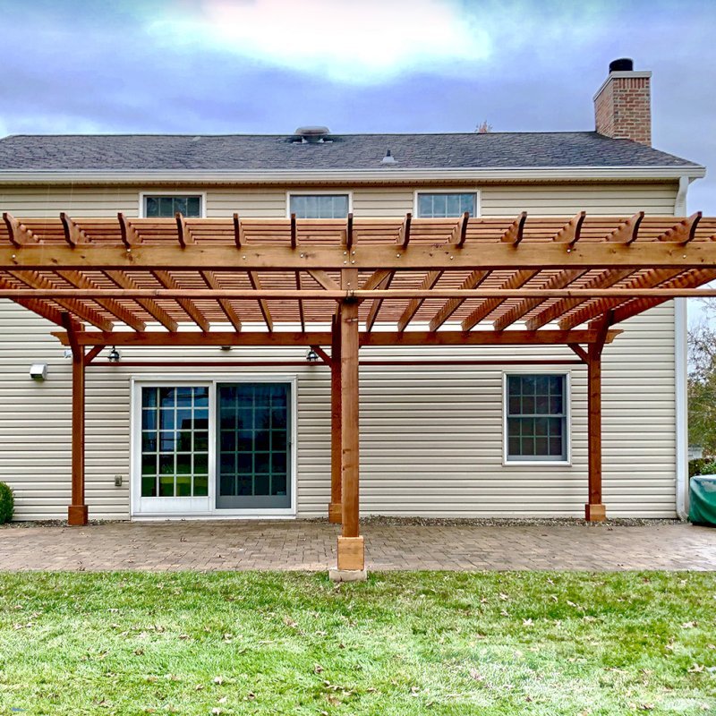 The Traditional Wooden Garden Pergola (Options: 26' L x 18' W, Mature Redwood, 2 Electrical Wiring Trims, Open Roof with Slats at 6", Rafters at 18", 6-Post Anchor Kit for Concrete, No Ceiling Fan Base, No Privacy Panels, No Post Decorative Trims, 2 Curtain Rod, 9' Post Height, Transparent Premium Sealant). Photo Courtesy of H. Wittreich of Somerset, New Jersey. The Traditional Wooden Garden Pergola (Options: 26' L x 18' W, Mature Redwood, 2 Electrical Wiring Trims, Open Roof with Slats at 6", Rafters at 18", 6-Post Anchor Kit for Concrete, No Ceiling Fan Base, No Privacy Panels, No Post Decorative Trims, 2 Curtain Rod, 9' Post Height, Transparent Premium Sealant). Photo Courtesy of H. Wittreich of Somerset, New Jersey.