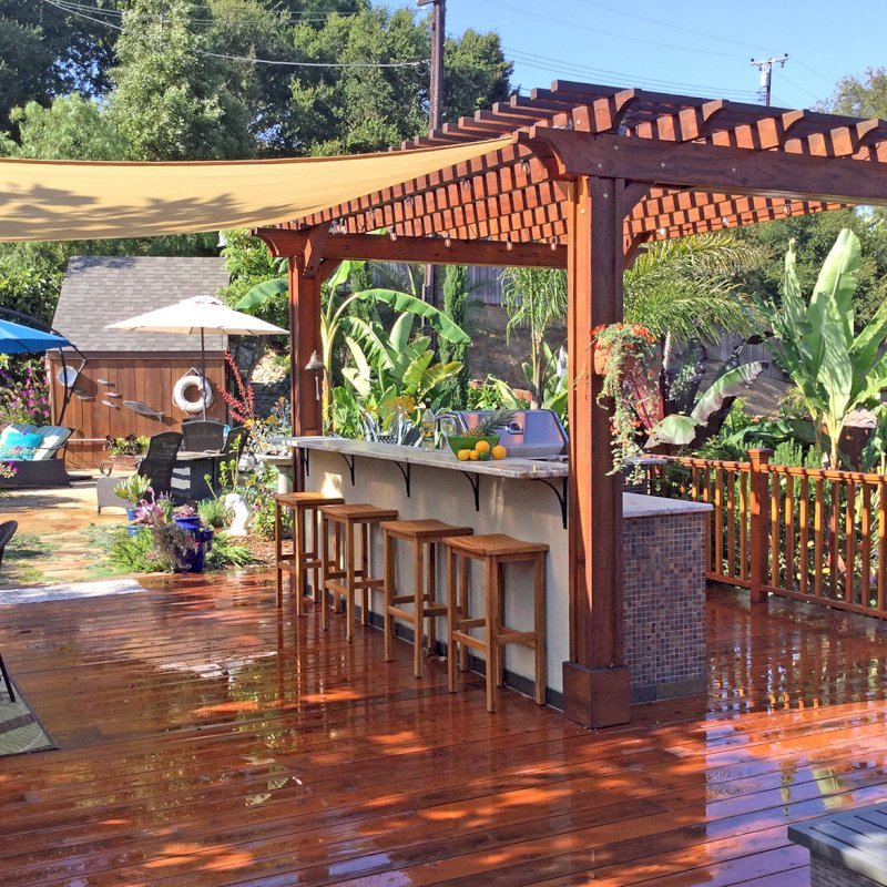 The Traditional Wooden Garden Pergola (Options: 14' L x 11' W, Mature Redwood, Electrical Wiring Trim for2 Posts, Open Roof with Slats at 6", Rafters at 18", 4-Post Anchor Kit for Wood, No Ceiling Fan Base, No Privacy Panels, Vertical Post Decorative Trims, No Curtain Rod, 9' Post Height, Transparent Premium Sealant). Photo Courtesy of J. Turner of Santa Barbara, California. The Traditional Wooden Garden Pergola (Options: 14' L x 11' W, Mature Redwood, Electrical Wiring Trim for2 Posts, Open Roof with Slats at 6", Rafters at 18", 4-Post Anchor Kit for Wood, No Ceiling Fan Base, No Privacy Panels, Vertical Post Decorative Trims, No Curtain Rod, 9' Post Height, Transparent Premium Sealant). Photo Courtesy of J. Turner of Santa Barbara, California.