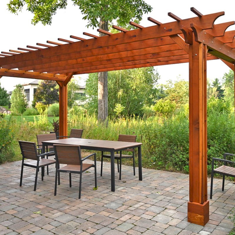 The Traditional Wooden Garden Pergola (Options: 20' L x 10' W, California Redwood, No Electrical Wiring Trim, Slats at 12" and Rafters at 18", Vertical Post Decorative Trims, Lengthwise Roof Support Timbers, 4-Post Anchor Kit For Concrete, No Ceiling Fan Base, No Privacy Panels, No Curtain Rods, 8.5' Post Height, Transparent Premium Sealant). Photo Courtesy of E. Weber of Lyndhurst, Ohio. The Traditional Wooden Garden Pergola (Options: 20' L x 10' W, California Redwood, No Electrical Wiring Trim, Slats at 12" and Rafters at 18", Vertical Post Decorative Trims, Lengthwise Roof Support Timbers, 4-Post Anchor Kit For Concrete, No Ceiling Fan Base, No Privacy Panels, No Curtain Rods, 8.5' Post Height, Transparent Premium Sealant). Photo Courtesy of E. Weber of Lyndhurst, Ohio.