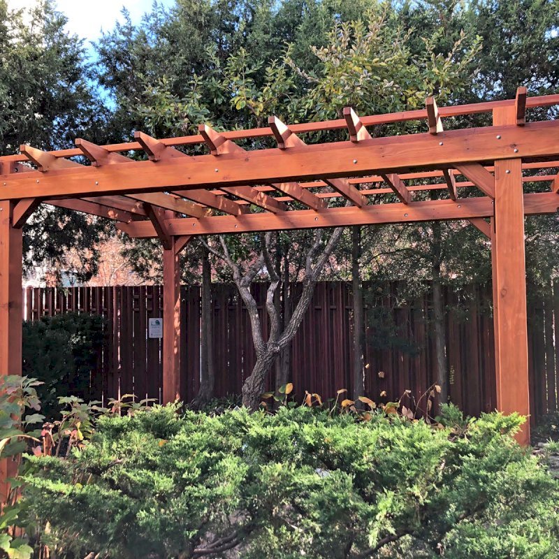 The Traditional Wooden Garden Pergola (Options: 14' L x 10' W, California Redwood, No Electrical Wiring Trim, Open Roof with Slats at 18", Rafters at 18", 4-Post Anchor Kit for Concrete, No Ceiling Fan Base, No Privacy Panels, No Post Decorative Trims, No Curtain Rod, 9' Post Height, Transparent Premium Sealant). Photo Courtesy of S. Schmidt of Philadelphia, Pennsylvania. The Traditional Wooden Garden Pergola (Options: 14' L x 10' W, California Redwood, No Electrical Wiring Trim, Open Roof with Slats at 18", Rafters at 18", 4-Post Anchor Kit for Concrete, No Ceiling Fan Base, No Privacy Panels, No Post Decorative Trims, No Curtain Rod, 9' Post Height, Transparent Premium Sealant). Photo Courtesy of S. Schmidt of Philadelphia, Pennsylvania.