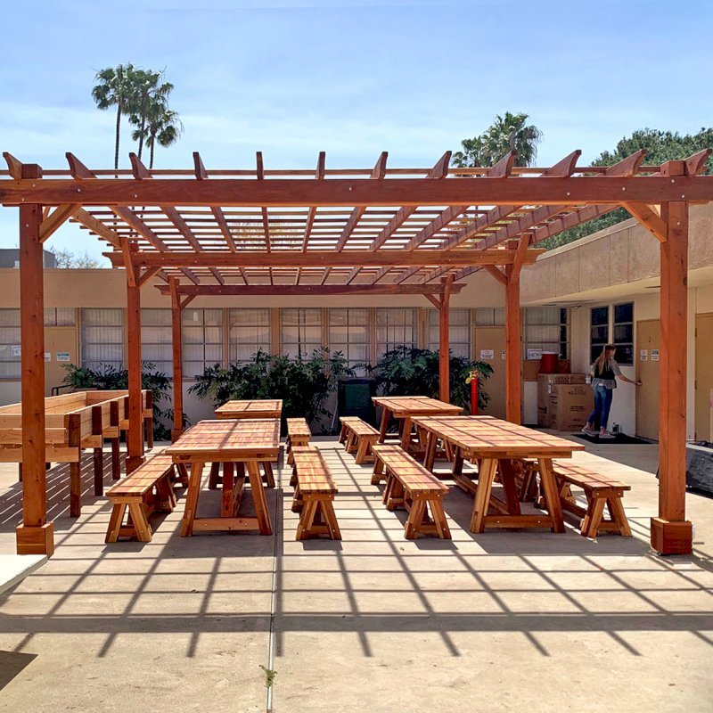 The Traditional Wooden Garden Pergola (Options: 30' L x 18' W, California Redwood, Electrical Wiring Trim for 2 Posts, Open Roof with Slats at 18", Rafters at 18", 6-Post Anchor Kit for Concrete, No Ceiling Fan Base, No Privacy Panels, No Curtain Rods, 10' Post Height, Transparent Premium Sealant). Photo also shows 4 Classic Redwood Patio Tables. Photo Courtesy of T. Sirvent of Costa Mesa, CA. The Traditional Wooden Garden Pergola (Options: 30' L x 18' W, California Redwood, Electrical Wiring Trim for 2 Posts, Open Roof with Slats at 18", Rafters at 18", 6-Post Anchor Kit for Concrete, No Ceiling Fan Base, No Privacy Panels, No Curtain Rods, 10' Post Height, Transparent Premium Sealant). Photo also shows 4 Classic Redwood Patio Tables. Photo Courtesy of T. Sirvent of Costa Mesa, CA.