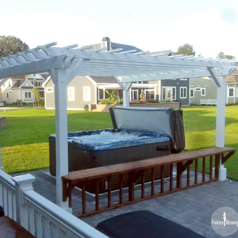The Traditional Wooden Garden Pergola (Options: 16' L x 14' W, Douglas-fir, No Electrical Wiring Trim, Open Roof with Slats at 12", Rafters at 18", 4-Post Anchor Kit for Concrete, No Ceiling Fan Base, No Privacy Panels, No Curtain Rods, 9' Post Height, Off-White Oil-Based Primer). Photo Courtesy of V. Yzaguirre of Lewes, Delaware. The Traditional Wooden Garden Pergola (Options: 16' L x 14' W, Douglas-fir, No Electrical Wiring Trim, Open Roof with Slats at 12", Rafters at 18", 4-Post Anchor Kit for Concrete, No Ceiling Fan Base, No Privacy Panels, No Curtain Rods, 9' Post Height, Off-White Oil-Based Primer). Photo Courtesy of V. Yzaguirre of Lewes, Delaware.