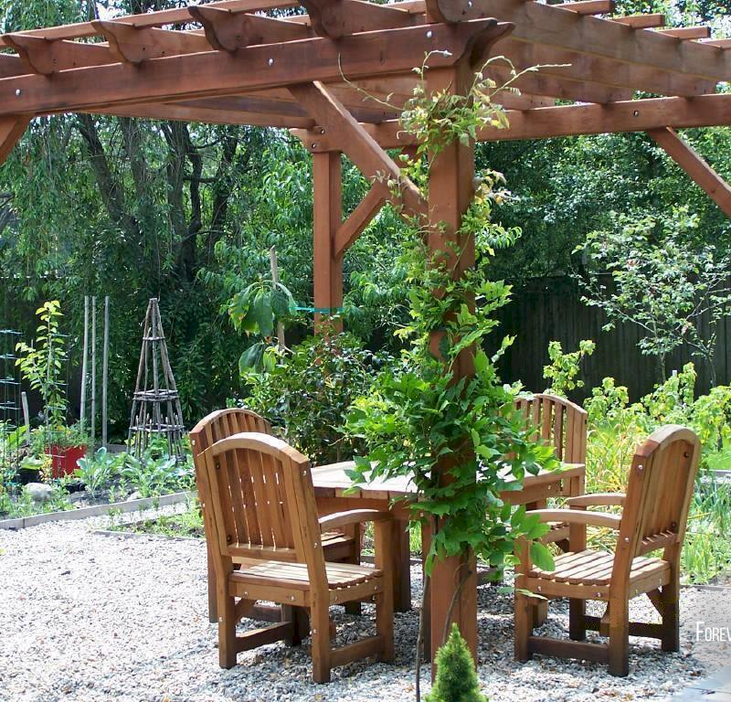 The Traditional Wooden Garden Pergola (Options: 12' L x 12' W, Old-Growth Redwood, No Electrical Wiring Trim, Open Roof with Slats at 18", Rafters at 18", 4 Post Anchor Kit for Stone, No Ceiling Fan Base, No Privacy Panels, No Curtain Rods, 9' Post Height, Transparent Premium Sealant). 4 ft Square Patio Table Set with Luna Armchairs Under the Pergola. Photo Courtesy of Ms. Anne Eccles of Lexington, MA. The Traditional Wooden Garden Pergola (Options: 12' L x 12' W, Old-Growth Redwood, No Electrical Wiring Trim, Open Roof with Slats at 18", Rafters at 18", 4 Post Anchor Kit for Stone, No Ceiling Fan Base, No Privacy Panels, No Curtain Rods, 9' Post Height, Transparent Premium Sealant). 4 ft Square Patio Table Set with Luna Armchairs Under the Pergola. Photo Courtesy of Ms. Anne Eccles of Lexington, MA.