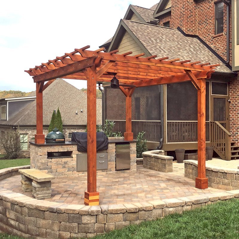 The Traditional Wooden Garden Pergola (Options: 14' L x 12' W, California Redwood, Electrical Wiring Trim for 2 Posts, Open Roof with Slats at 12", Rafters at 18", 4-Post Anchor Kit, 1 Ceiling Fan Base, No Privacy Panels, No Curtain Rods, Transparent Premium Sealant). Photo Courtesy of T. Wade of Clinton, TN. The Traditional Wooden Garden Pergola (Options: 14' L x 12' W, California Redwood, Electrical Wiring Trim for 2 Posts, Open Roof with Slats at 12", Rafters at 18", 4-Post Anchor Kit, 1 Ceiling Fan Base, No Privacy Panels, No Curtain Rods, Transparent Premium Sealant). Photo Courtesy of T. Wade of Clinton, TN.
