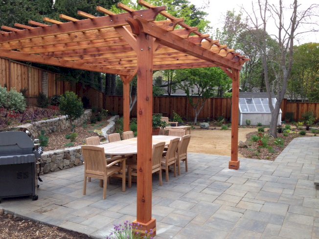 The Traditional Wooden Garden Pergola (Options: 16' L x 14' W, California Redwood, No Electrical Wiring Trim, Open Roof with Slats at 12", Rafters at 18", Lengthwise Roof Support Timbers, 4-Post Anchor Kit for Stone, No Ceiling Fan Base, No Curtain Rods, No Privacy Panels, 9' Post Height, Transparent Premium Sealant). Photo Courtesy of Paul Remer of San Rafael, CA. The Traditional Wooden Garden Pergola (Options: 16' L x 14' W, California Redwood, No Electrical Wiring Trim, Open Roof with Slats at 12", Rafters at 18", Lengthwise Roof Support Timbers, 4-Post Anchor Kit for Stone, No Ceiling Fan Base, No Curtain Rods, No Privacy Panels, 9' Post Height, Transparent Premium Sealant). Photo Courtesy of Paul Remer of San Rafael, CA.