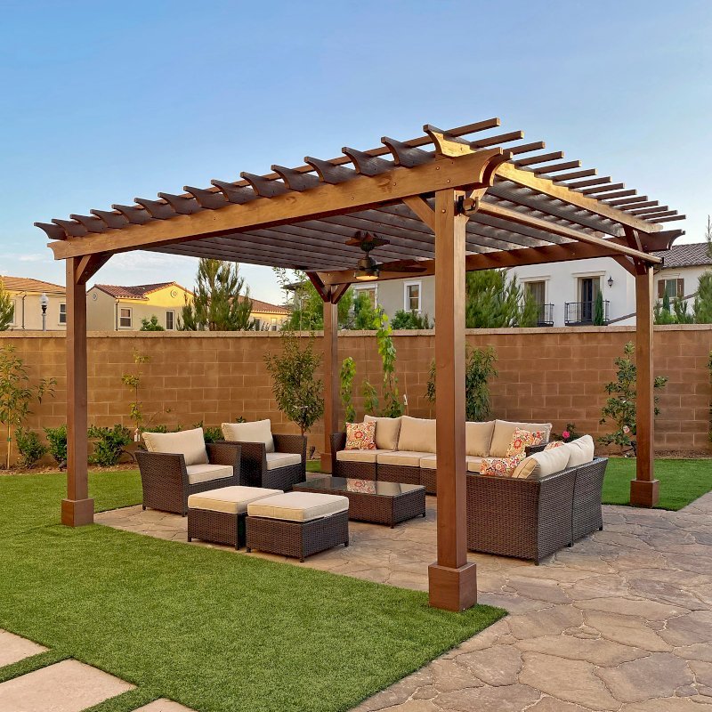 The Traditional Wooden Garden Pergola (Options: 16' L x 15' W, Douglas-fir, 1 Electrical Wiring Trim, Open Roof with Slats at 12", Rafters at 12", 4-Post Anchor Kit for Concrete, 1 Ceiling Fan Base, No Privacy Panels, 1 Curtain Rod, 9.5' Posts, Custom Paint). Photo Courtesy of M. Ibrahim of Irvine, California. The Traditional Wooden Garden Pergola (Options: 16' L x 15' W, Douglas-fir, 1 Electrical Wiring Trim, Open Roof with Slats at 12", Rafters at 12", 4-Post Anchor Kit for Concrete, 1 Ceiling Fan Base, No Privacy Panels, 1 Curtain Rod, 9.5' Posts, Custom Paint). Photo Courtesy of M. Ibrahim of Irvine, California.