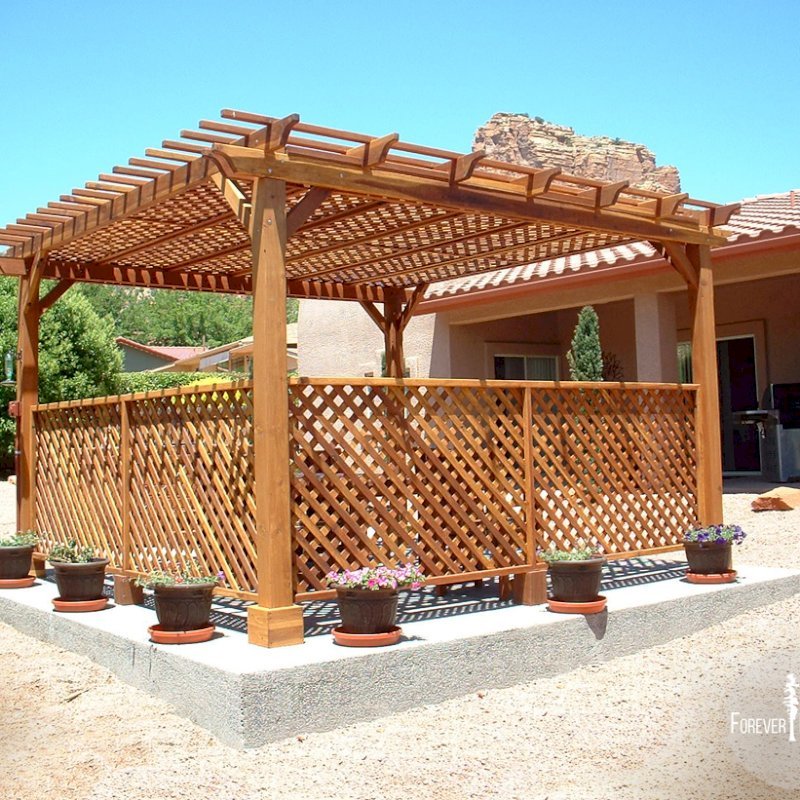 The Traditional Wooden Garden Pergola (Options: 15' x 15', California Redwood, No Electrical Wiring Trim, Lattice Panel Roof, 4-post Anchor Kit for Stone, No Ceiling Fan Base, 2 Privacy Panels, No Curtain Rods, 9' Post Height, Transparent Premium Sealant). Under the Pergola, a 7' San Francisco Patio Table Set with 42" W Tabletop, 4 Ruth Chairs and 2 Ruth Armchairs. Photo Courtesy of Mr. Joseph Dlugosz of Sedona, AZ. The Traditional Wooden Garden Pergola (Options: 15' x 15', California Redwood, No Electrical Wiring Trim, Lattice Panel Roof, 4-post Anchor Kit for Stone, No Ceiling Fan Base, 2 Privacy Panels, No Curtain Rods, 9' Post Height, Transparent Premium Sealant). Under the Pergola, a 7' San Francisco Patio Table Set with 42" W Tabletop, 4 Ruth Chairs and 2 Ruth Armchairs. Photo Courtesy of Mr. Joseph Dlugosz of Sedona, AZ.