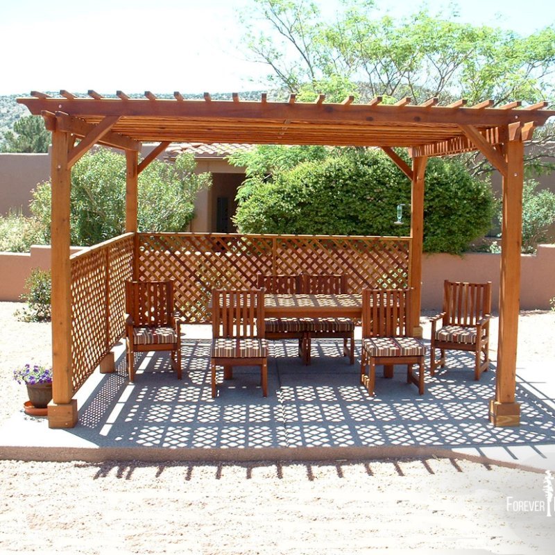 The Traditional Wooden Garden Pergola (Options: 15' x 15', California Redwood, No Electrical Wiring Trim, Lattice Panel Roof, 4-post Anchor Kit for Stone, No Ceiling Fan Base, 2 Privacy Panels, No Curtain Rods, 9' Post Height, Transparent Premium Sealant). Under the Pergola, a 7' San Francisco Patio Table Set with 42" W Tabletop, 4 Ruth Chairs and 2 Ruth Armchairs. Photo Courtesy of Mr. Joseph Dlugosz of Sedona, AZ. The Traditional Wooden Garden Pergola (Options: 15' x 15', California Redwood, No Electrical Wiring Trim, Lattice Panel Roof, 4-post Anchor Kit for Stone, No Ceiling Fan Base, 2 Privacy Panels, No Curtain Rods, 9' Post Height, Transparent Premium Sealant). Under the Pergola, a 7' San Francisco Patio Table Set with 42" W Tabletop, 4 Ruth Chairs and 2 Ruth Armchairs. Photo Courtesy of Mr. Joseph Dlugosz of Sedona, AZ.