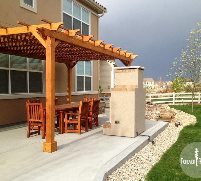 The Traditional Wooden Garden Pergola (Options: 20' L x 12' W, Mature Redwood, No Electrical Wiring Trim, Lattice Roof, Lengthwise Roof Support Timbers, 4-Post Anchor Kit for Stone, No Ceiling Fan Base, No Privacy Panels, No Curtain Rods, 9.5' Post Height, Transparent Premium Sealant). The Traditional Wooden Garden Pergola (Options: 20' L x 12' W, Mature Redwood, No Electrical Wiring Trim, Lattice Roof, Lengthwise Roof Support Timbers, 4-Post Anchor Kit for Stone, No Ceiling Fan Base, No Privacy Panels, No Curtain Rods, 9.5' Post Height, Transparent Premium Sealant).